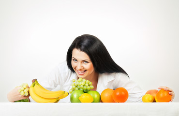 Wall Mural - brunette woman with fruits