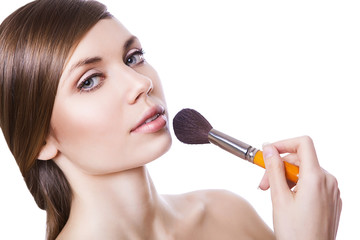 natural sexy woman with cosmetic brush