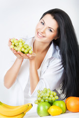 Wall Mural - sexy smiling woman with grape in hands