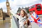 Fototapeta Londyn - London - happy tourist holding UK flag by Big Ben