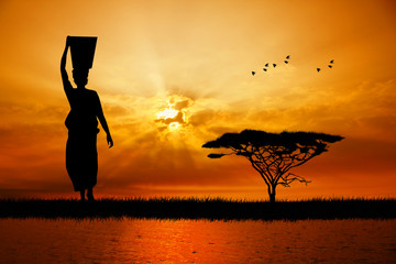 Poster - African woman at sunset