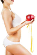 Sporty Woman With Red Apple And Yellow Measure