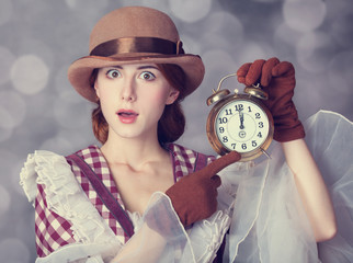 Wall Mural - beautiful redhead women with clock.