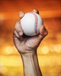 close up of a pitcher hand throws a baseball