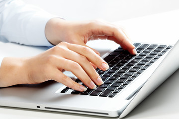 Aufkleber - Hands with laptop computer keyboard.