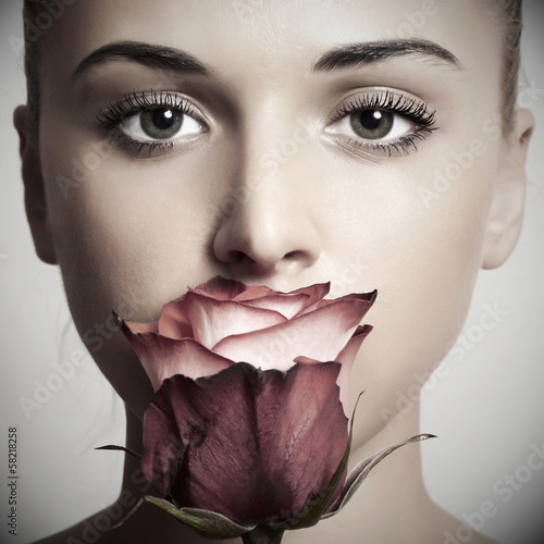 Fototapeta dla dzieci beautiful blond woman with flower.girl and rose.skin care