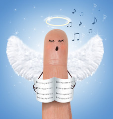 Leinwandbilder - Singing angel on finger