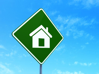 Business concept: Home on road sign background