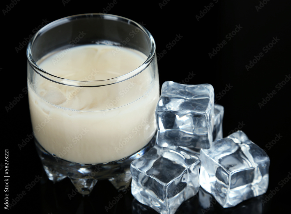 Baileys liqueur in glass isolated on black