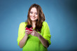 © Voyagerix - Happy girl with mobile phone reads message