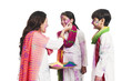 © imagedb.com - Woman celebrating Holi festival with her children