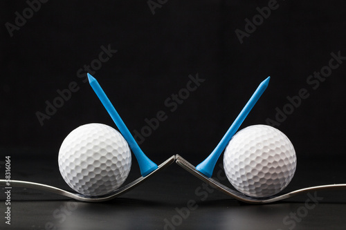 Golf balls on the black background Stock Photo | Adobe Stock