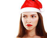 Fototapeta Do pokoju - dissatisfied girl in Santa's hat