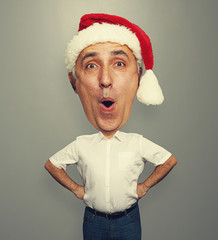 Fototapete - excited bighead man in red santa hat