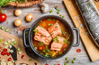 Closeup of fish soup with salmon and dill