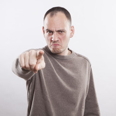 angry man accusing you, pointing finger at you!