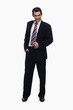 © imagedb.com - Portrait of a businessman standing with his hand in pocket