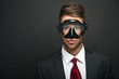 Businessman on a black background wearing a snorkel and mask