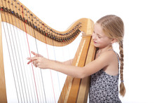 Young Girl In Blue Playing Harp