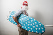 © Eugenio Marongiu - funny santa claus babbo natale ironing surfer