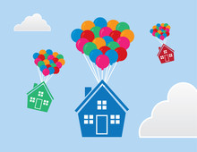 Houses With Balloons Floating Through The Sky