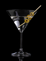 Poster - Martini glass and olives isolated on black