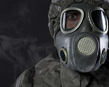 The Man In A Gas Mask In Smoke