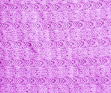 Background Of Purple Knitted Fabric. Texture