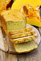 Poster - Bread homemade pumpkin on a board with a knife