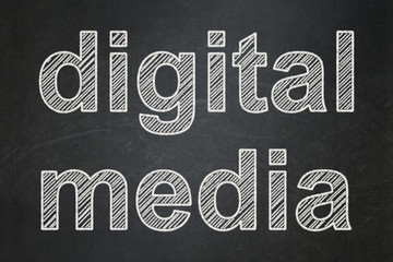 marketing concept: digital media on chalkboard background