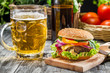 Closeup of homemade burger and a cold beer