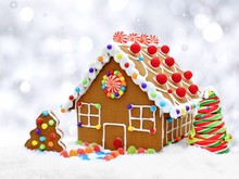 Gingerbread House In Snow With Twinkling Silver Light Background