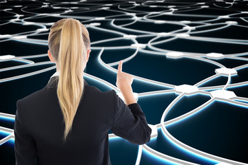 Wall Mural - Composite image of business woman pointing somewhere