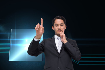 Poster - Composite image of thoughtful asian businessman pointing