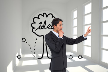 Poster - Composite image of thoughtful asian businessman pointing