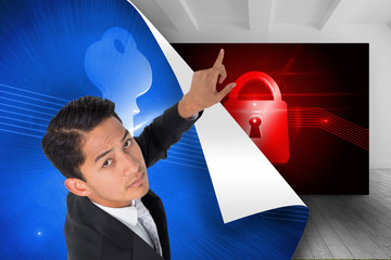 Poster - Composite image of unsmiling asian businessman pointing