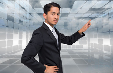 Poster - Composite image of unsmiling asian businessman pointing