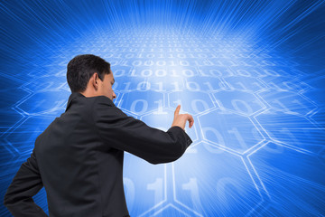 Poster - Composite image of unsmiling asian businessman pointing