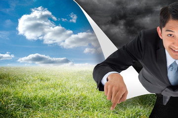 Poster - Composite image of smiling asian businessman pointing