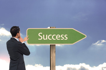 Poster - Composite image of thoughtful asian businessman pointing