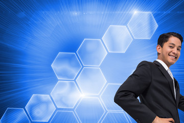 Poster - Composite image of smiling asian businessman pointing