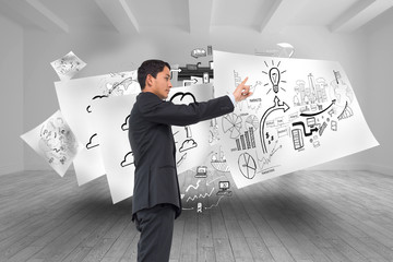 Poster - Composite image of serious asian businessman pointing