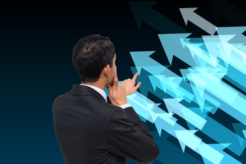 Poster - Composite image of thoughtful asian businessman pointing