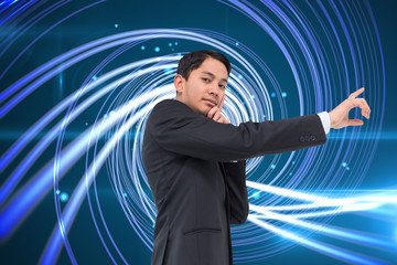 Poster - Composite image of thoughtful asian businessman pointing