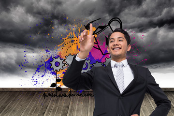Poster - Composite image of smiling asian businessman pointing
