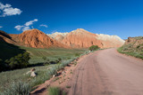 Fototapeta Natura - Road and eroded mountains in Kyrgyzstan