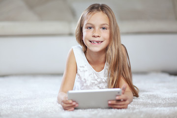 Sticker - Child playing on tablet pc