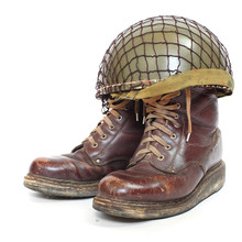 Retro Military Helmet And Boots On A White Background.