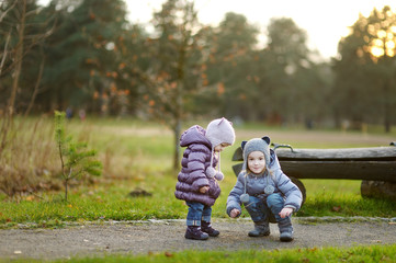 Wall Mural - Two sisters playing outdoors