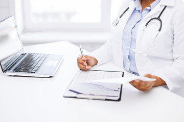 Poster - female doctor writing prescription